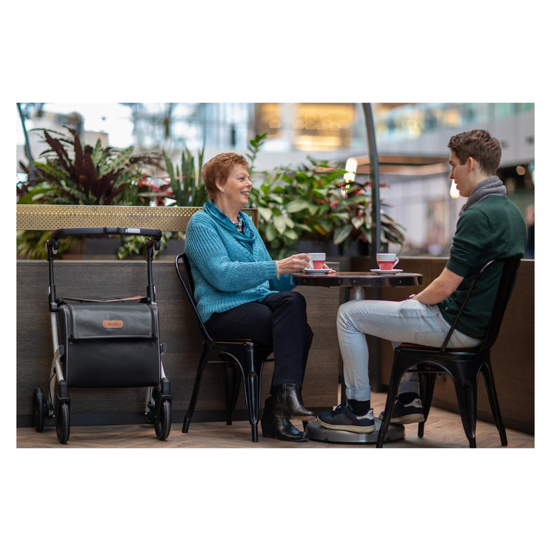 Rollz Flex2 Folding Rollator with Shopping Bag – in use at a cafe