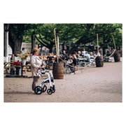 Rollz Motion2 Rollator & Transport Chair – resting at a cafe