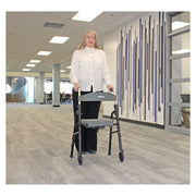 Triumph Essentials walker with seat – in use